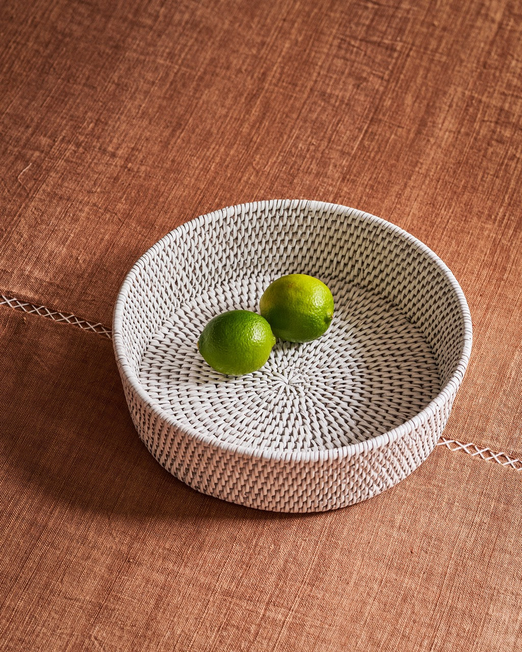 Zali round rattan basket in white, side view